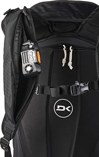 Black backpack with radio attached to strap