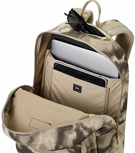 Open camouflage backpack with laptop and sunglasses.