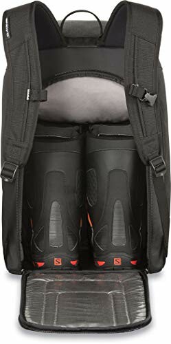 Black ski boot backpack with open compartment showing boots.